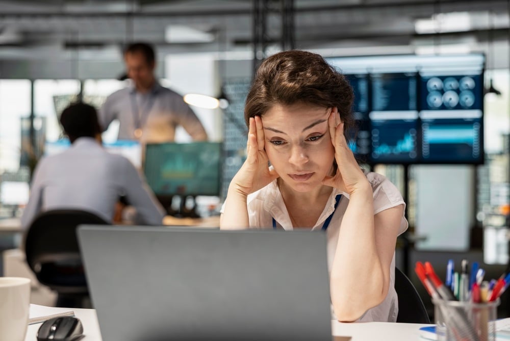 Why Your SEO is Working, But Your Site Traffic Isn't - frustrated woman at her computer